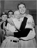 Leo Durocher hugs Bobby Thomson.
